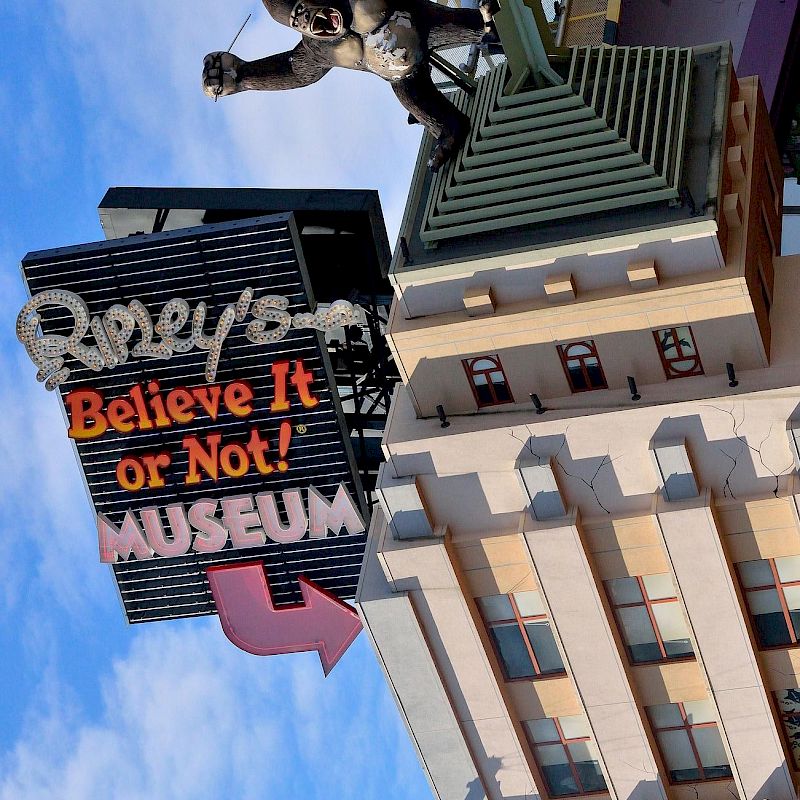 A building with a Ripley's Believe It or Not! Museum sign, featuring a giant ape sculpture climbing it.