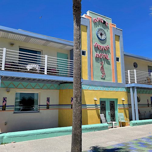 The image shows a colorful two-story building called 